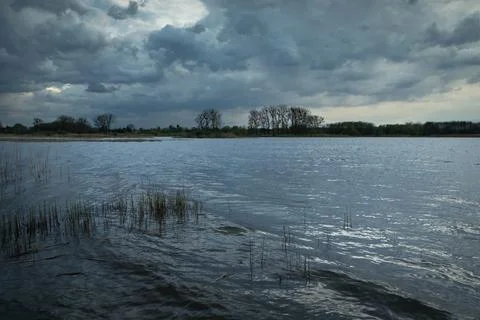 Cloudy sky over the lake Stock Photos
