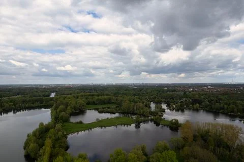 Cloudy sky over a lake surrounded by trees, a serene natural landscape Hanover Foto stock