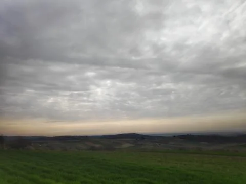 Cloudy Sky Over Meadow with Distant Horizon Panorama 스톡 사진