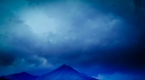 Cloudy sky over mountain, winter image Stock Photos