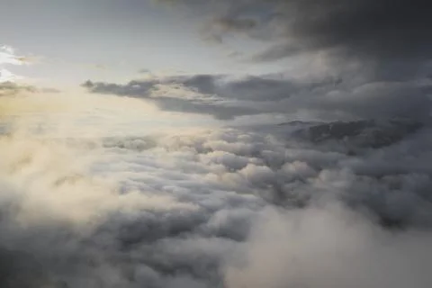 Cloudy sky over mountains background Stock Photos