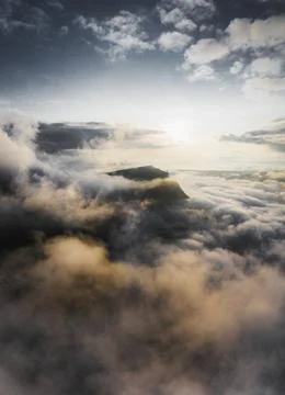 Cloudy sky over mountains background Stock Photos