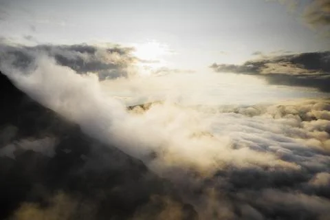 Cloudy sky over mountains background Stock Photos