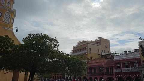 Cloudy Sky Over Plaza With Clock Tower and Tree, Cartagena, Colombia 8K Stock Footage 331502619