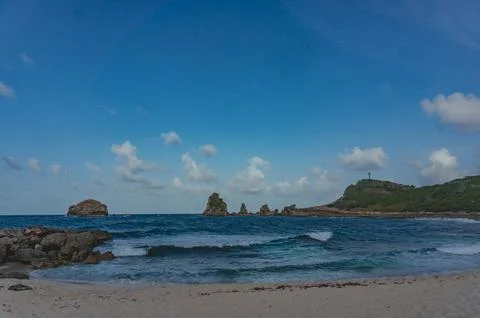 Cloudy sky over Pointe de Châteaux beach in Saint-Francois, Guadeloupe Stock Photos