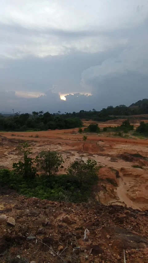 Cloudy sky over red earth Stock Footage 336045731