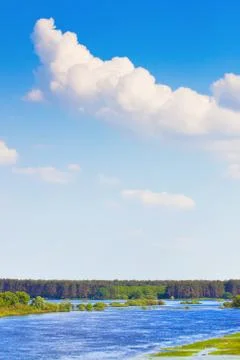 Cloudy sky over the river Stock Photos