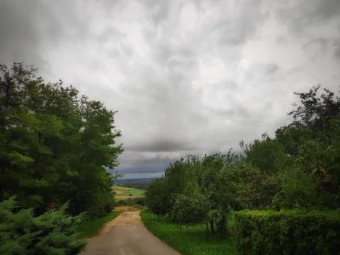 Cloudy Sky Over the Road and Nature 库存照片