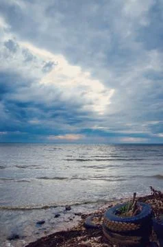 Cloudy sky over the sea Stock Photos