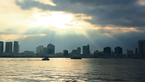 Cloudy sky over skyscrapers at sunset, Odaiba, Tokyo, Japan. Stock Footage 79034951