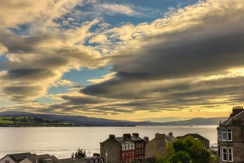 Cloudy Sky Over Small Town With River Stock Photos