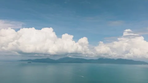 Cloudy sky over turquoise sea with distant mountains. Ko Pha Ngan, Thailand. Stock Footage 297176819
