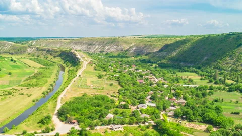 Cloudy Sky over A Valley With A River Stock Footage 93562569