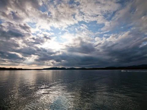 Cloudy sky over water Stock Photos