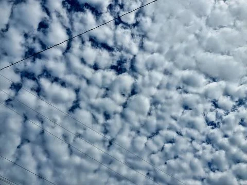 Cloudy sky with power lines Stock Photos