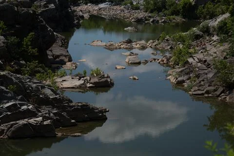 Cloudy Sky Reflected on Flat Water Foto stock