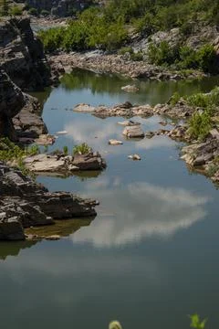 Cloudy Sky Reflected on Flat Water Vertical Stock Photos