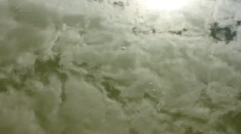 Cloudy sky reflected in water surface Stockbeeldmateriaal 52738502