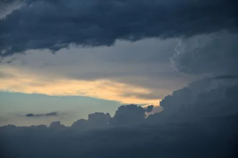 Cloudy sky right before a rainfall at sunset seen up close Stock Photos