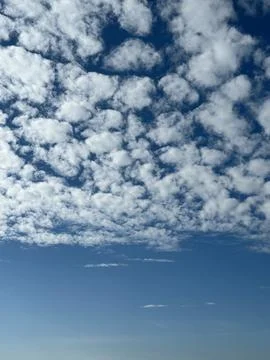 Cloudy sky with scattered cumulus clouds and blue background, suitable for .. Stock Photos