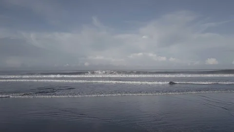 CLOUDY SKY, SMALL-MEDIUM WAVES BREAKING ON SHORE | EXT, AERIAL | 2398 | 4K Stock Footage 105193474