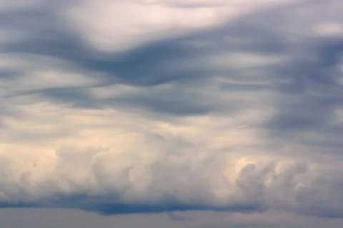 Cloudy sky with storm clouds, background. Stock Photos