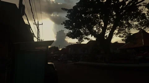 Cloudy Sky, Street, Tree Silhouettes Video stock 307704224