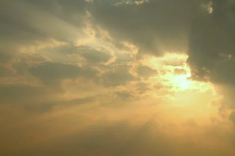 Cloudy sky with sun ray during sunset Stock Photos