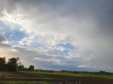 Cloudy sky with sunlight breaking through clouds 스톡 사진