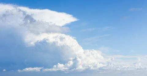 Cloudy sky on a sunny day.  Natural panoramic background Stock Photos