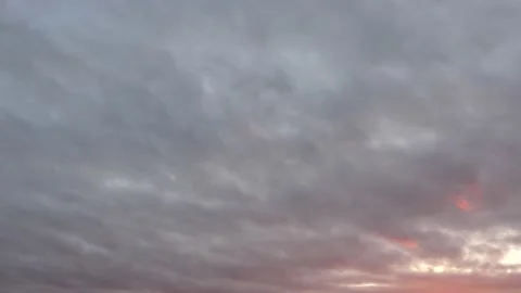 Cloudy sky at sunrise - beautiful clouds - natural sky background - time lapse Stock Footage 144373710
