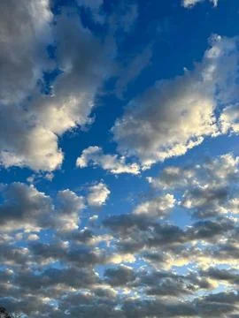 Cloudy sky at sunset Stock Photos