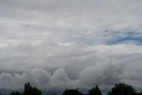 Cloudy sky before a thunderstorm panoramic background. Stock Photos