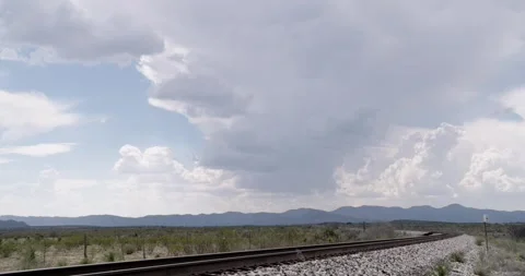 Cloudy Sky with Train Tracks in Foreground - West Texas Stock Footage 256049470
