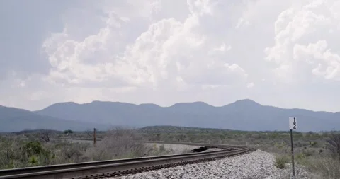 Cloudy Sky with Train Tracks in Foreground - West Texas Stock Footage 256049488