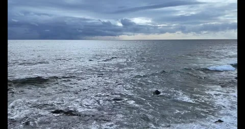 Cloudy sky video clip. Cloud over the sea dramatic video. 4k seascape horiz.. Stock Footage 303414571