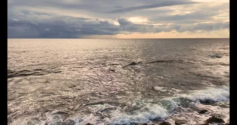 Cloudy sky video clip. Cloud over the sea dramatic video. 4k seascape horiz.. Stock Footage 303414633