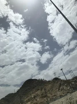 The cloudy sky view with a pole Stock Photos