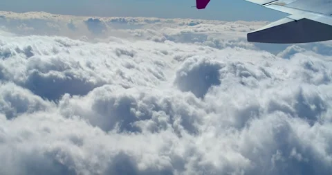 Cloudy on sky on the view from the window on the wing of the airplane. Stock Footage 258849622