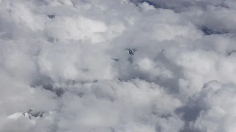 Cloudy sky viewed from airplane window. White clouds, aerial perspective Stock Footage 313237465