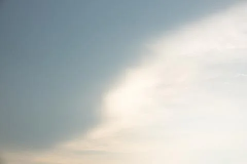 A cloudy sky with a white cloud in the middle Stock Photos