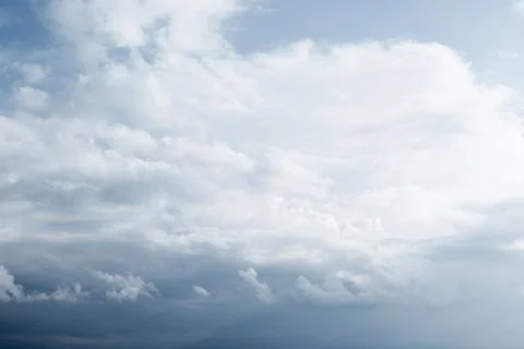 Cloudy sky with white clouds and blue background Stock Photos