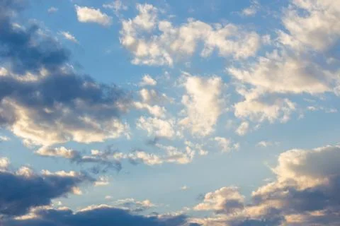 Cloudy sky in yellow light Stock Photos