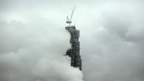 Cloudy Skyline with Tower Under Construction Stock Footage 324633582