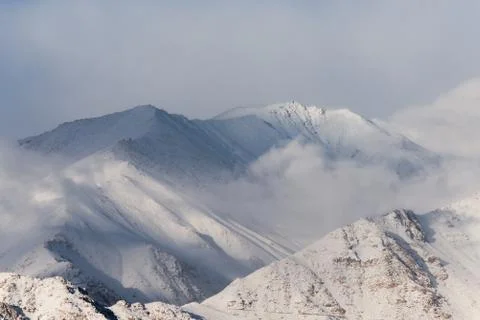 Cloudy snow mountain in winter 스톡 사진