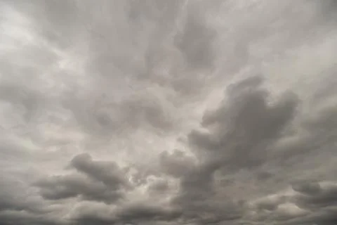 Cloudy stormy sky. Dark clouds drift across sky. Overcast with swirling storm 写真素材