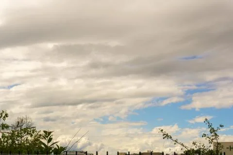 A cloudy summer sky below a German city Foto stock