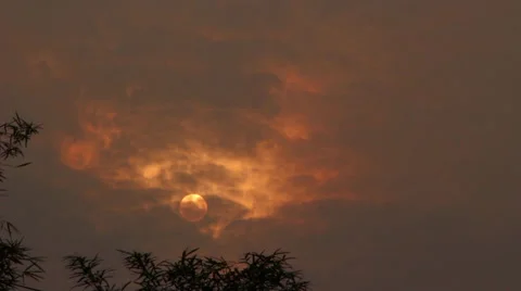 Cloudy Sun @ 135mm Stock Footage 32169126