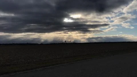 Cloudy Sunlight Over Small Town Watertower Stock Photos