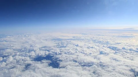 Cloudy sunny sky from the airplane window Stock Footage 136892636